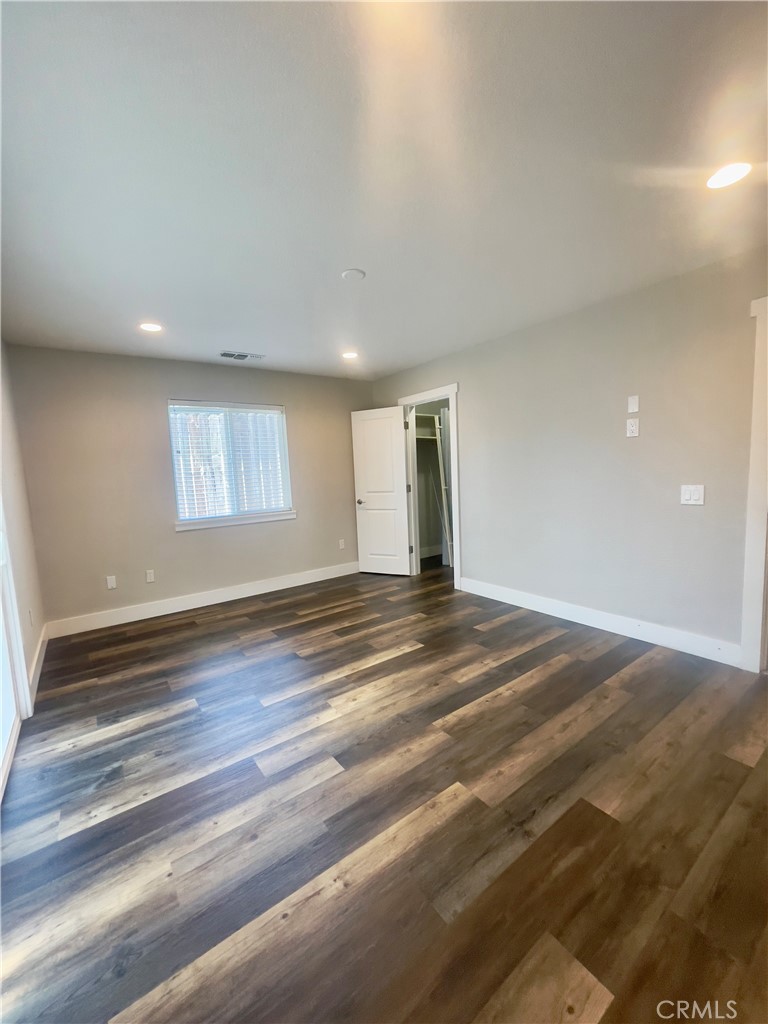 8317 Keyesport Way Citrus Heights, CA 95610 - Photo 14 of 28 a view of empty room and wooden floor