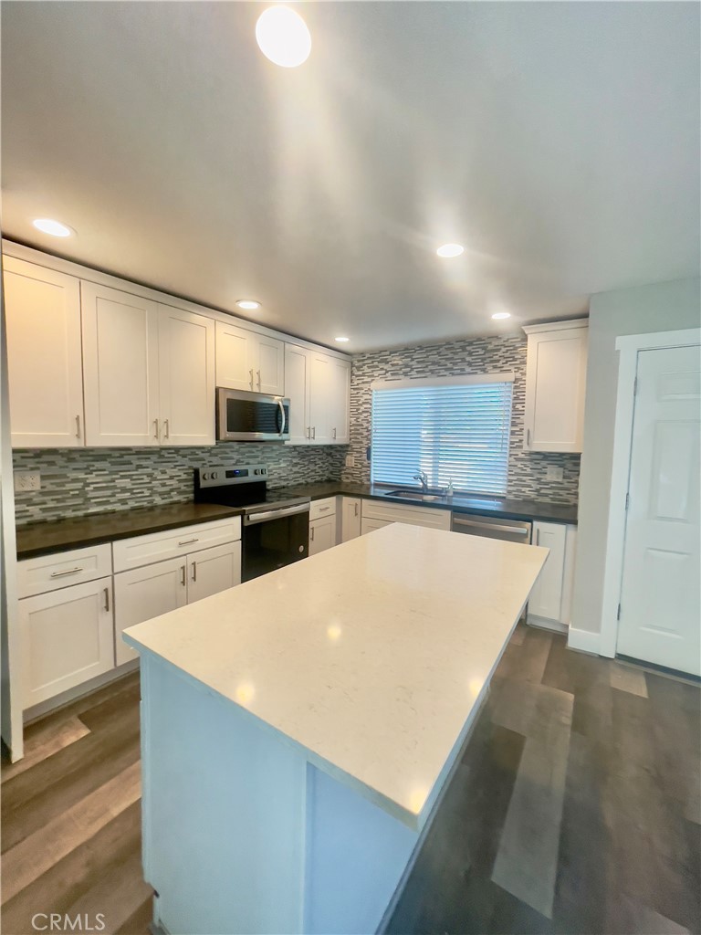 8317 Keyesport Way Citrus Heights, CA 95610 - Photo 6 of 28 a kitchen with stainless steel appliances a refrigerator sink and stove