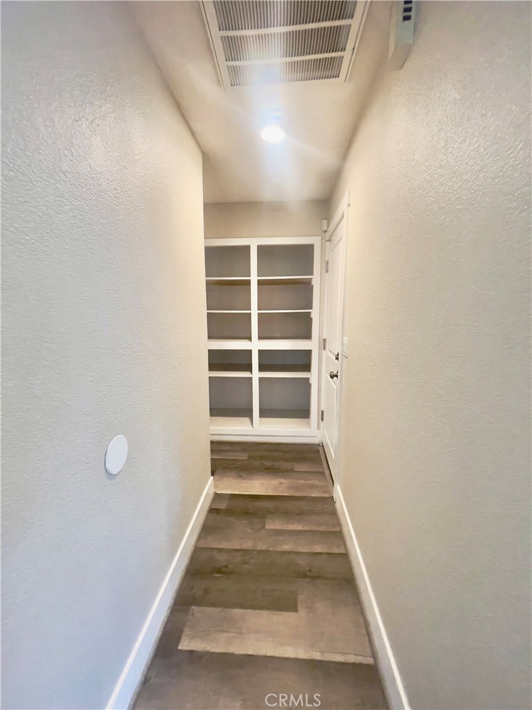 8317 Keyesport Way Citrus Heights, CA 95610 - Photo 9 of 28 a view of an empty room with a window and wooden floor