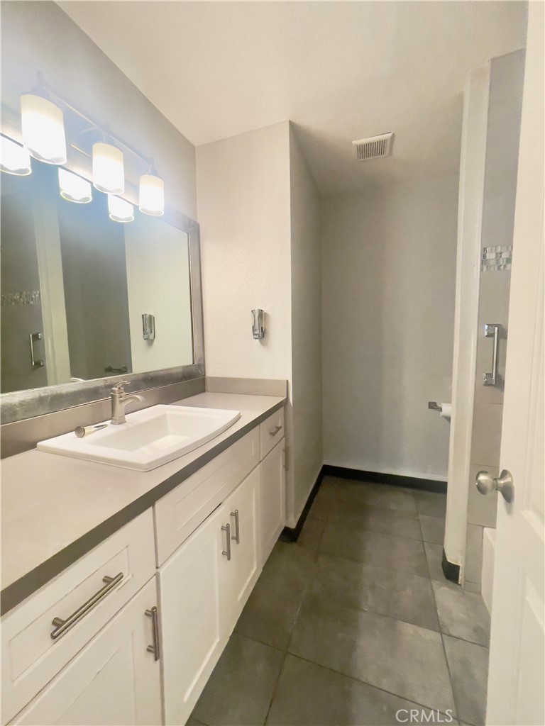 8317 Keyesport Way Citrus Heights, CA 95610 - Photo 10 of 28 a bathroom with a double vanity sink and a mirror