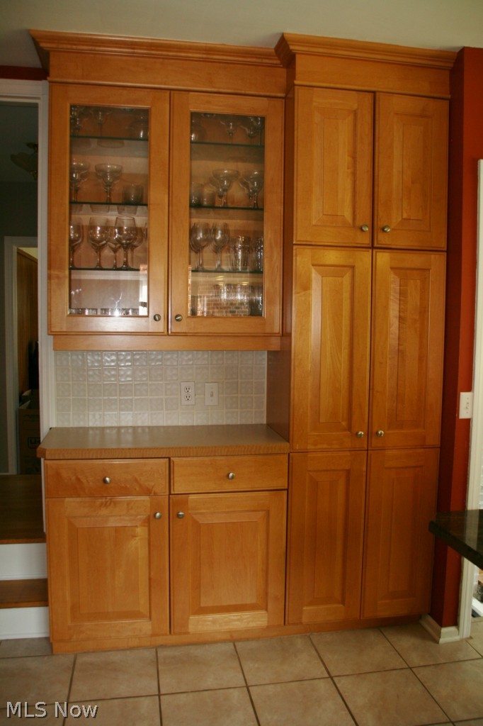 2452 Dysart Road Cleveland, OH 44118 - Photo 9 of 22 Another view of the glass display cabinet and floor to ceiling pantry cabinet. There is simply a place for everything!