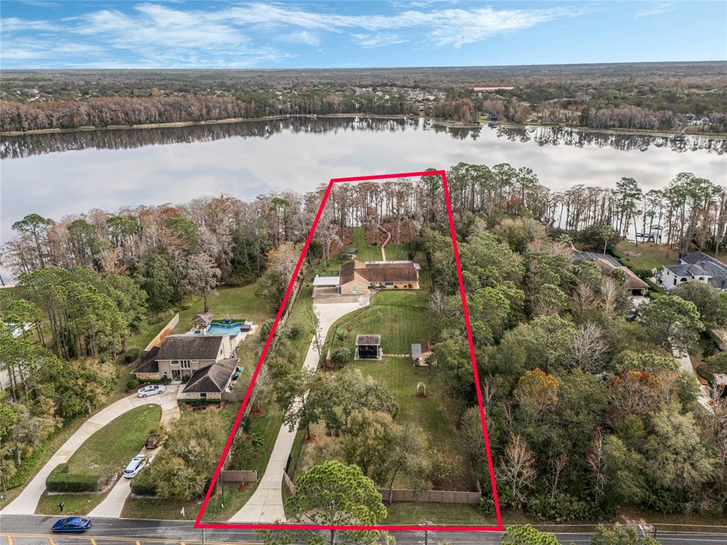 Located on almost 2 acres on Lake Price 
