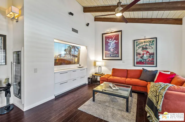 a bedroom with furniture and a large window