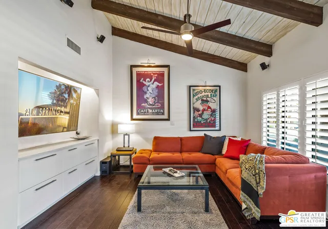 a bedroom with a bed and a table