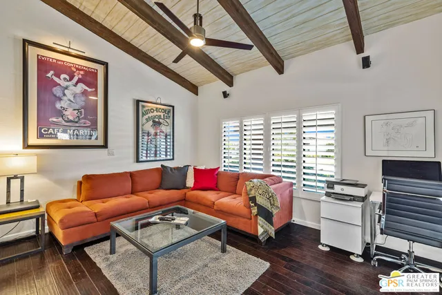 a bedroom with a bed a dresser and a large mirror