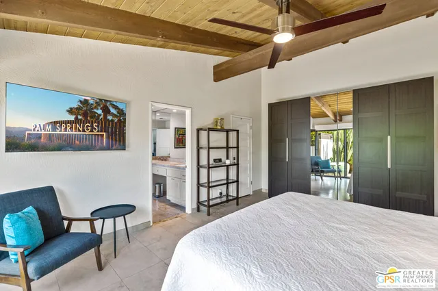 a bedroom with a bed and a dresser