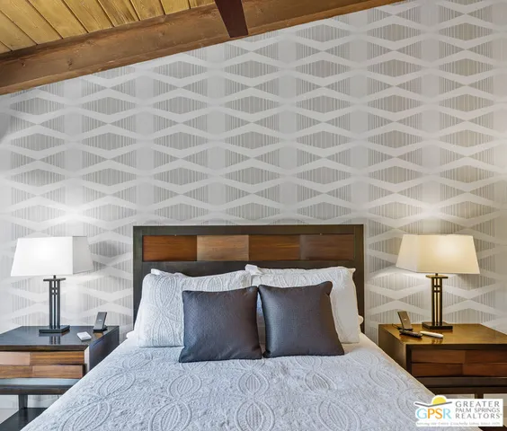 a view of a patio with a dining table and chairs under an umbrella