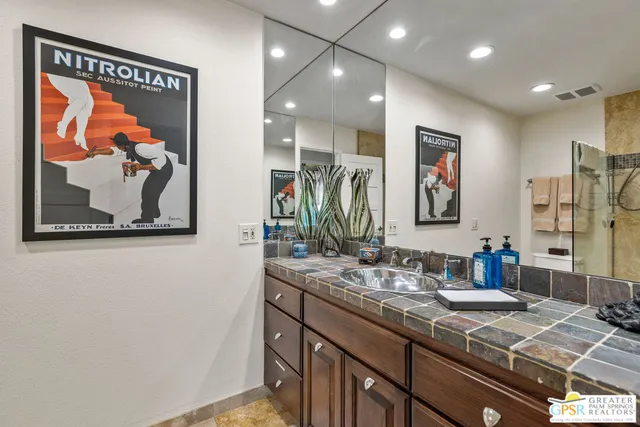 a view of a patio with a table and chairs