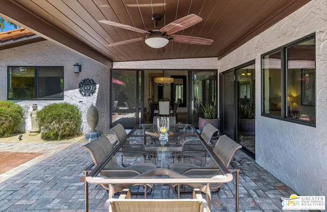 a view of a yard with an outdoor seating