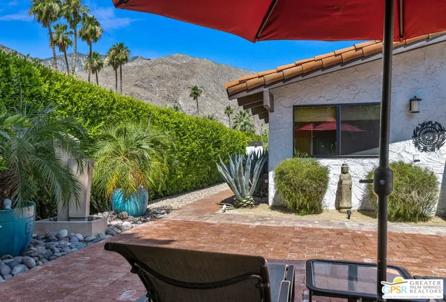 a view of a park with swings and slides