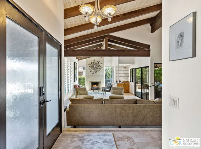 a living room with furniture and a rug