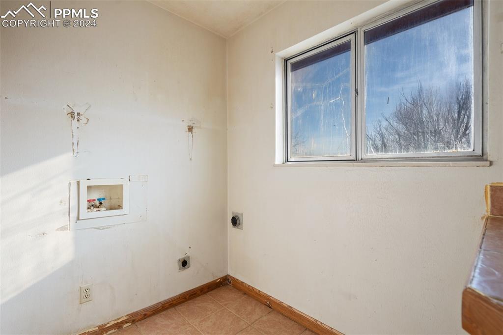 7615 Maverick Road Colorado Springs, CO 80908 - Photo 22 of 42 a view of a small space with wooden floor and a window