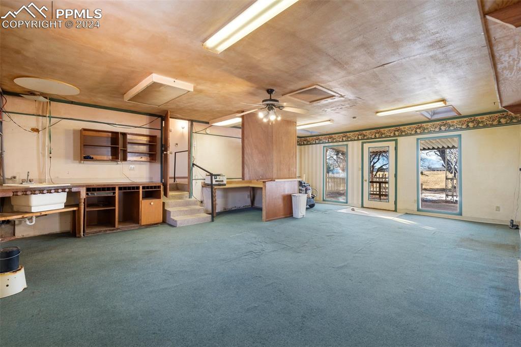 7615 Maverick Road Colorado Springs, CO 80908 - Photo 27 of 42 a view of a livingroom with furniture and windows