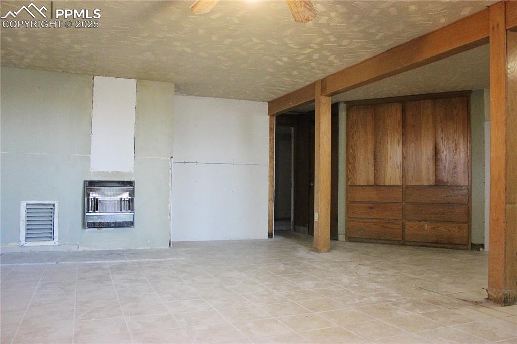7615 Maverick Road Colorado Springs, CO 80908 - Photo 30 of 42 an empty room with closet and cabinet