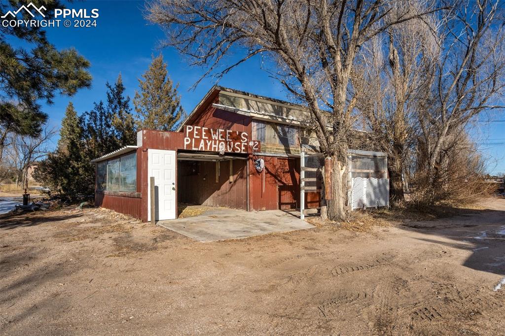7615 Maverick Road Colorado Springs, CO 80908 - Photo 35 of 42 a view of a house with a yard covered with snow