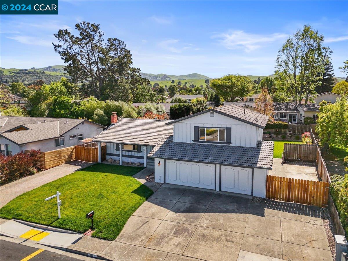 an aerial view of a house with a garden