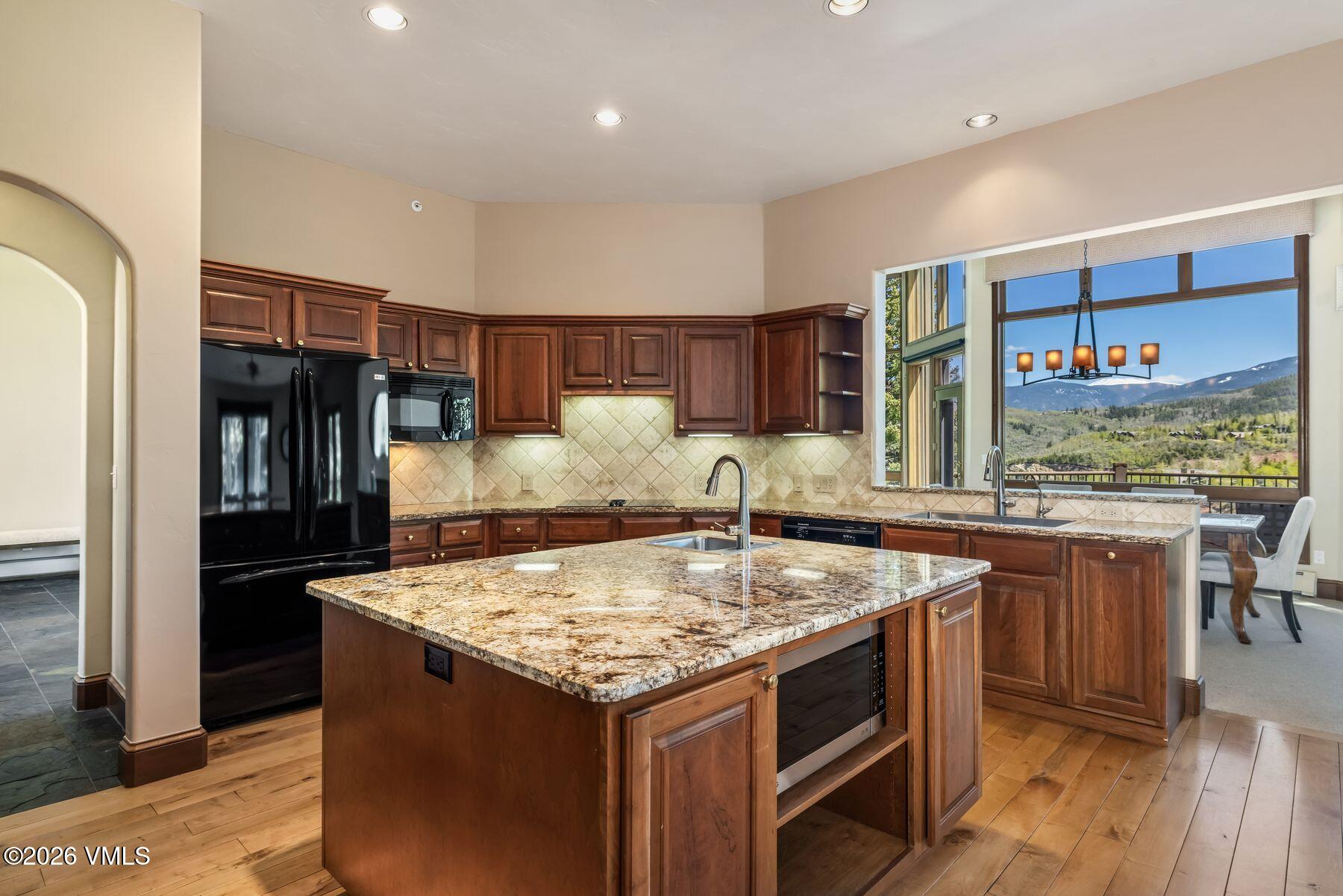 167 Saddle Ridge Edwards, CO 81632 - Photo 14 of 41 a kitchen with a stove and a refrigerator