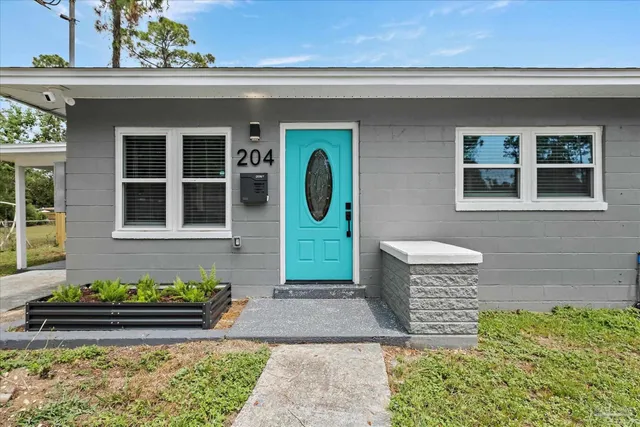a front view of a house with garden