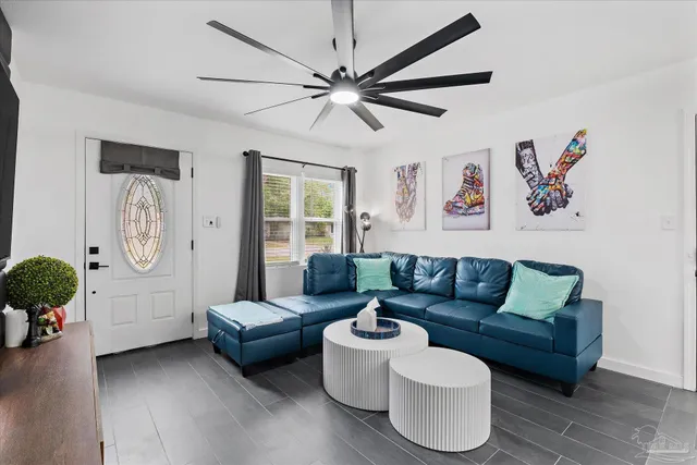 a living room with furniture and a large window