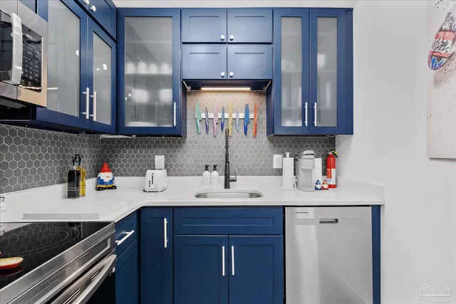 a kitchen with a sink and cabinets