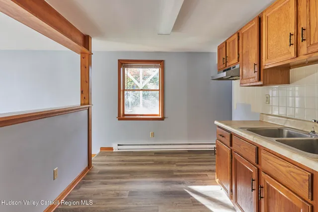 a kitchen with a sink and cabinets