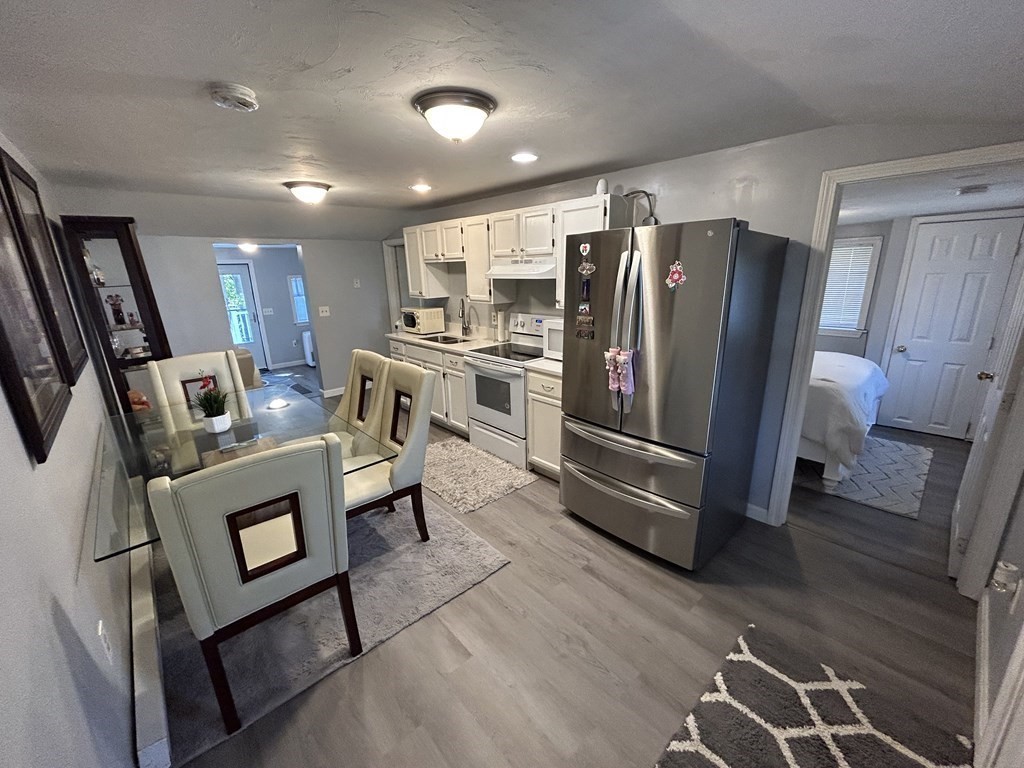 222 Gore Road Webster, MA 01570 - Photo 15 of 32 a kitchen with stainless steel appliances granite countertop a refrigerator stove and sink