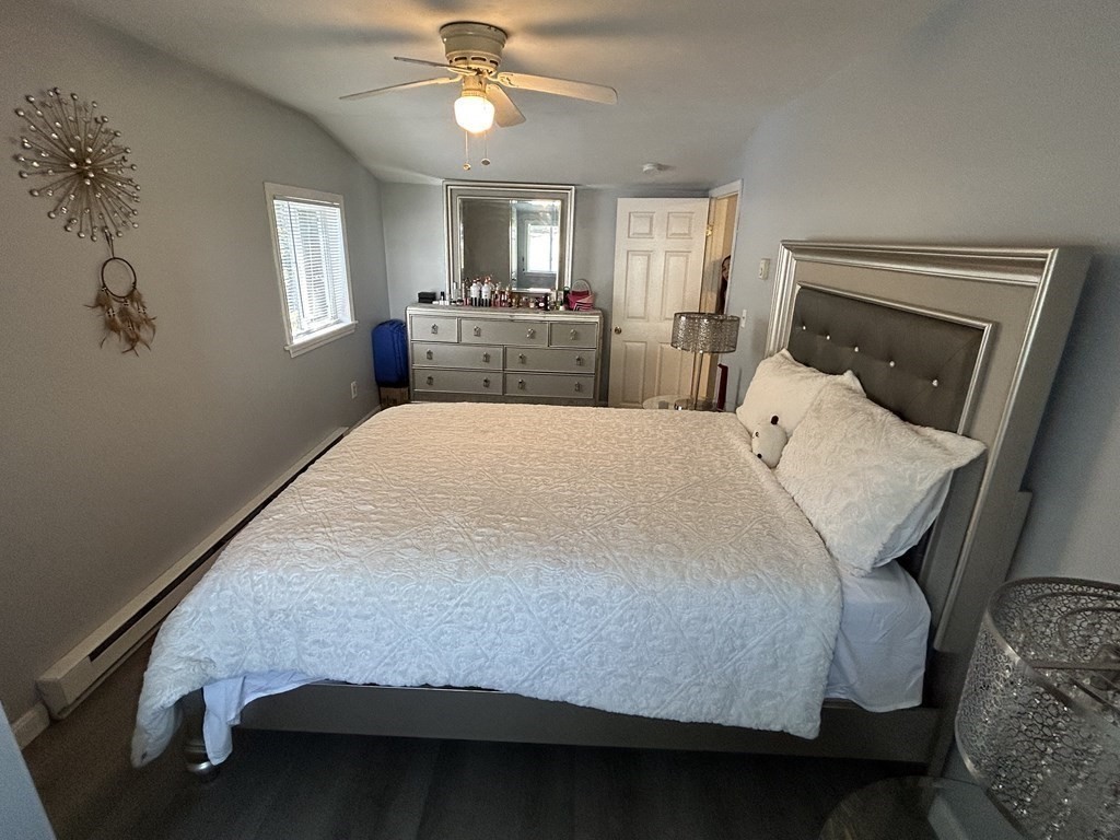 222 Gore Road Webster, MA 01570 - Photo 18 of 32 a bed sitting in a spacious bedroom next to a window
