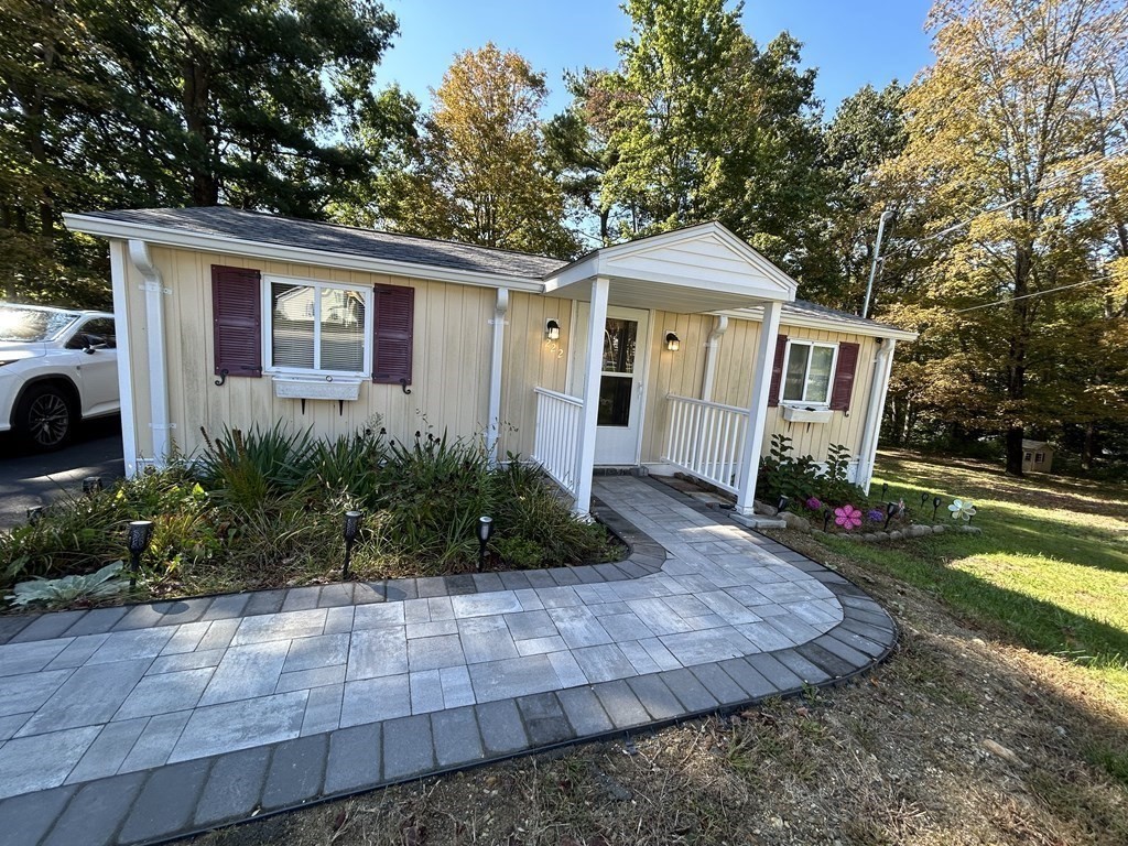 222 Gore Road Webster, MA 01570 - Photo 2 of 32 a front view of a house with garden