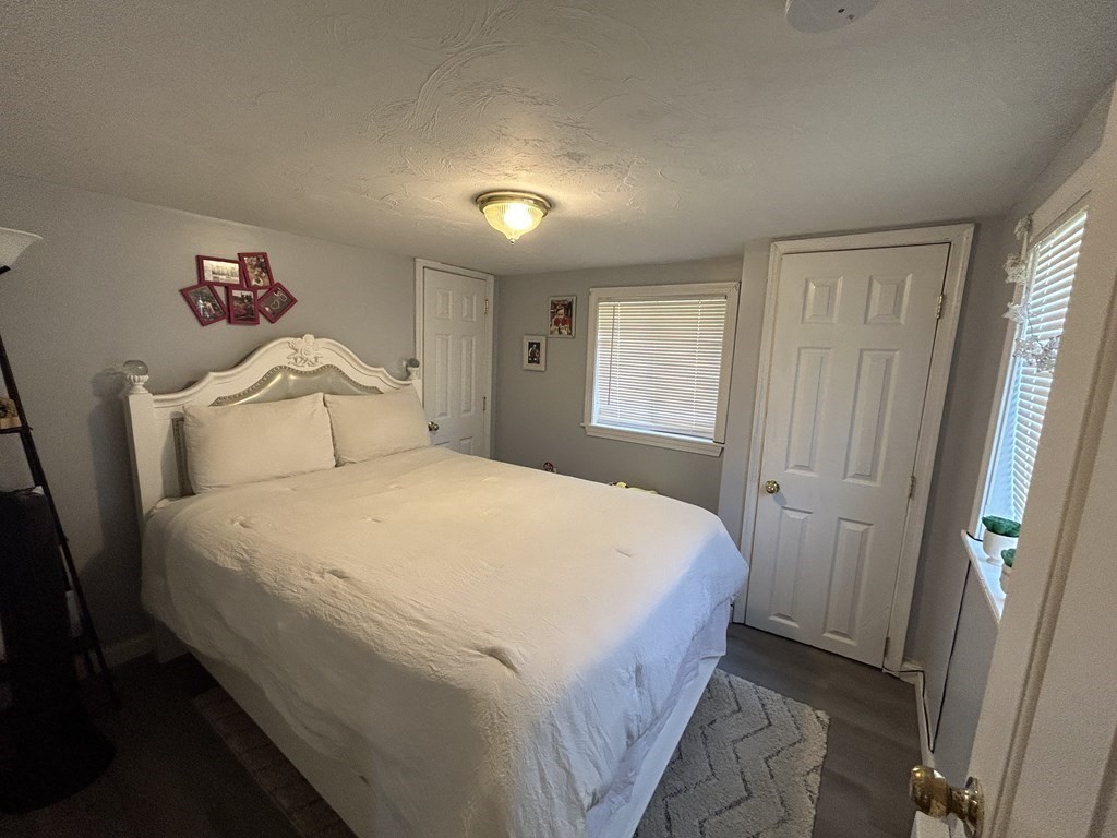 222 Gore Road Webster, MA 01570 - Photo 26 of 32 a bedroom with a bed and a window