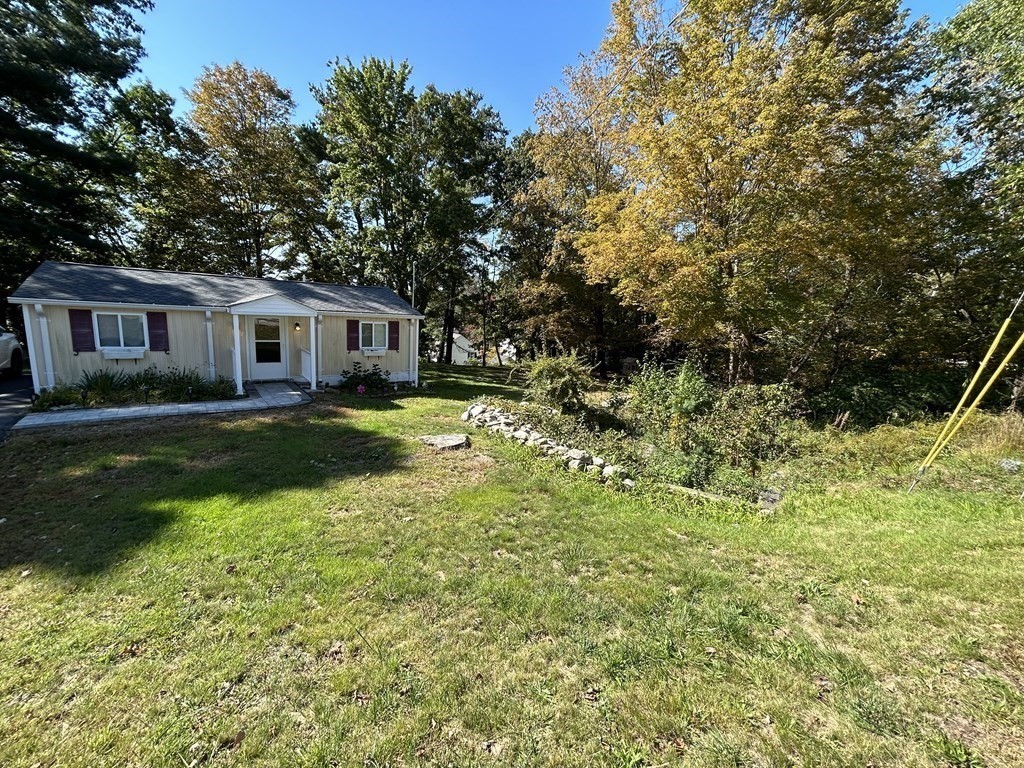 222 Gore Road Webster, MA 01570 - Photo 3 of 32 a view of a house with a yard patio and fire pit