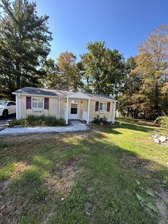 222 Gore Road Webster, MA 01570 - Photo 31 of 32 a front view of house with yard and trees in the background