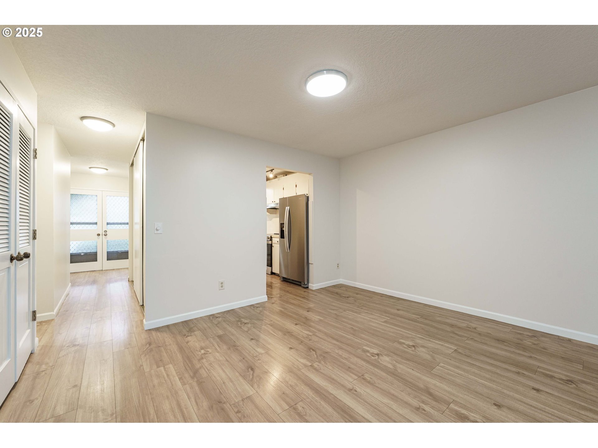4248 Northeast 125th Place Portland, OR 97230 - Photo 12 of 42 a view of an empty room and wooden floor