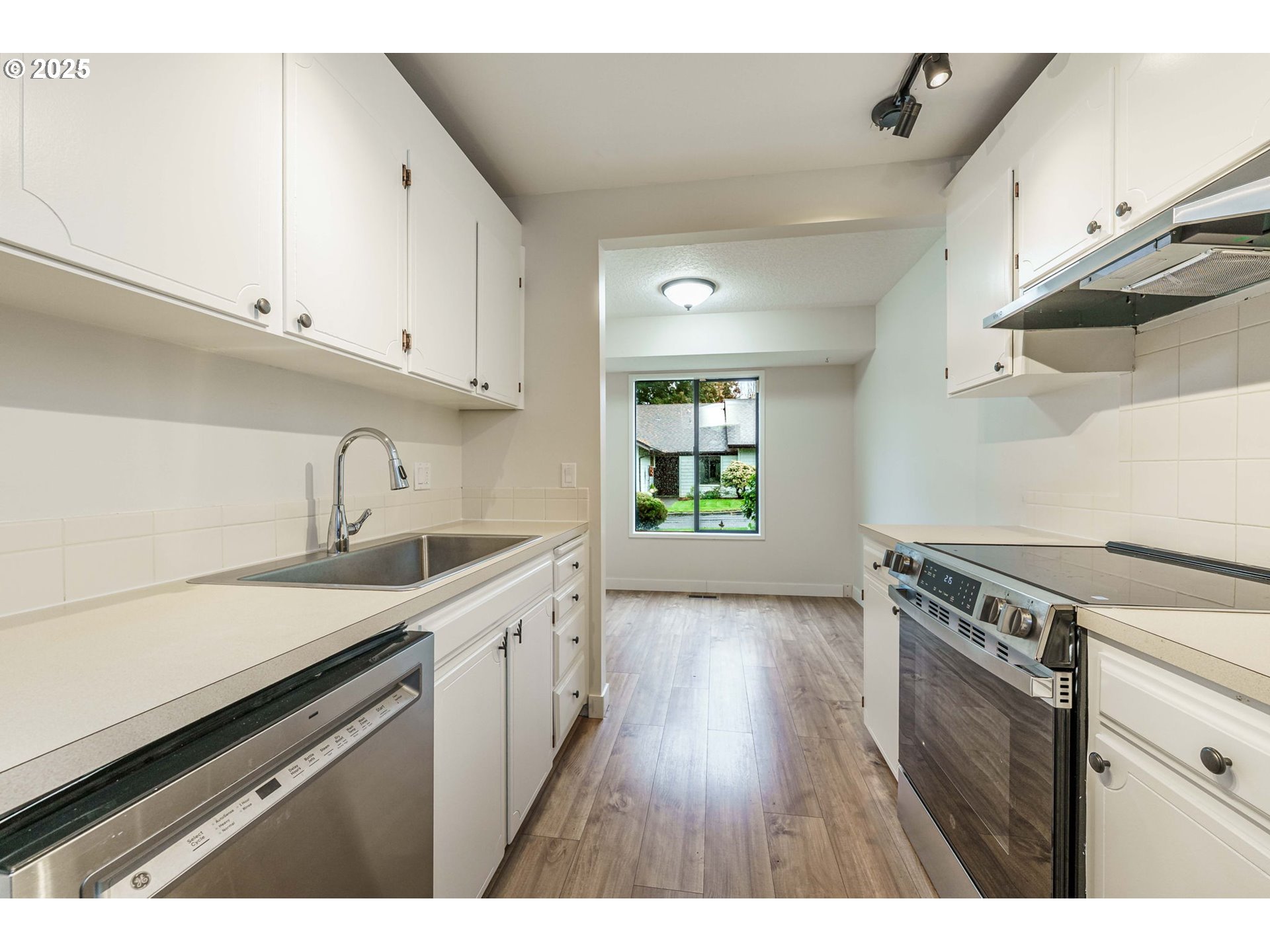4248 Northeast 125th Place Portland, OR 97230 - Photo 14 of 42 a kitchen with a sink cabinets and window