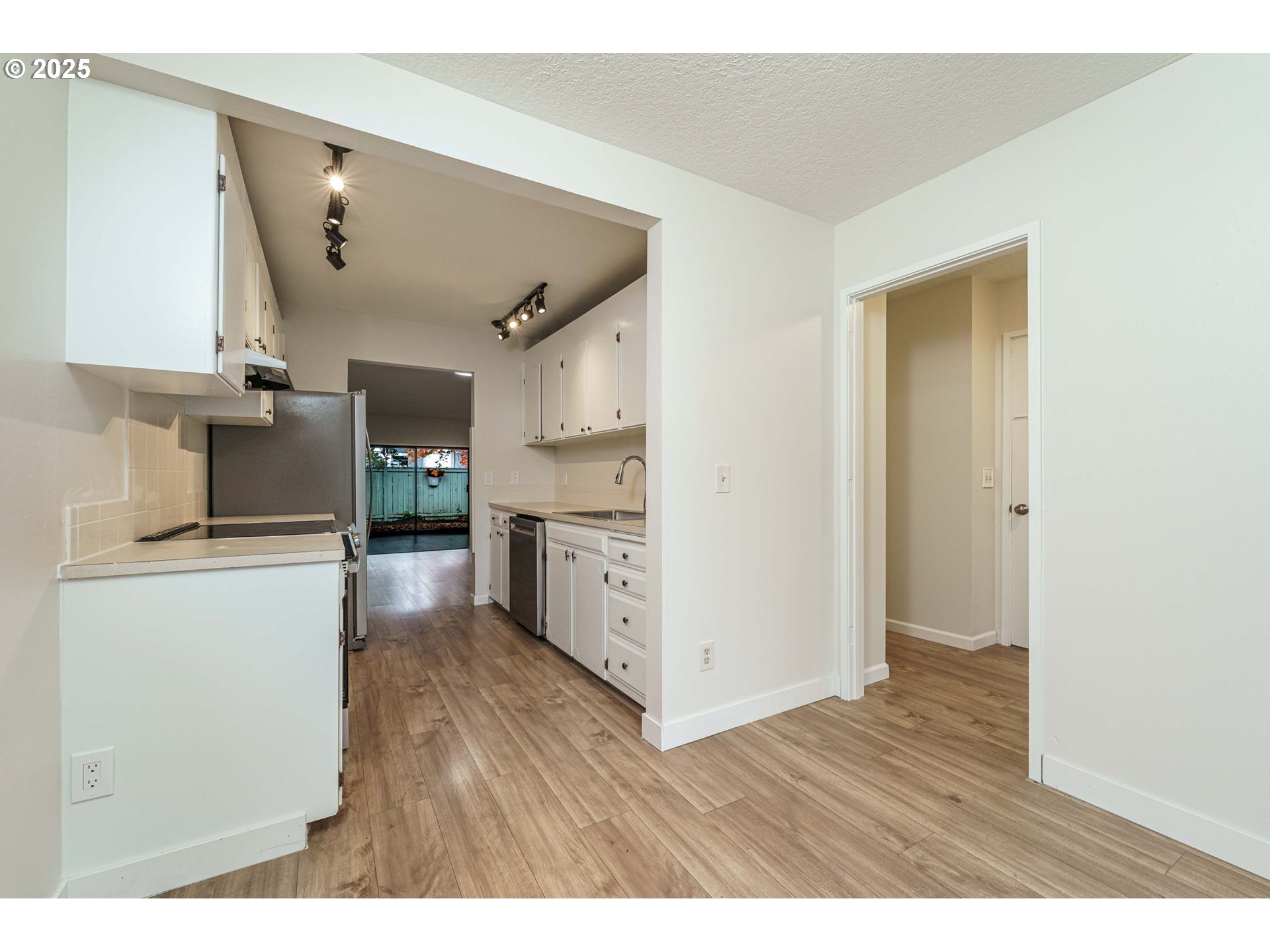 4248 Northeast 125th Place Portland, OR 97230 - Photo 16 of 42 a open kitchen with cabinets and wooden floor