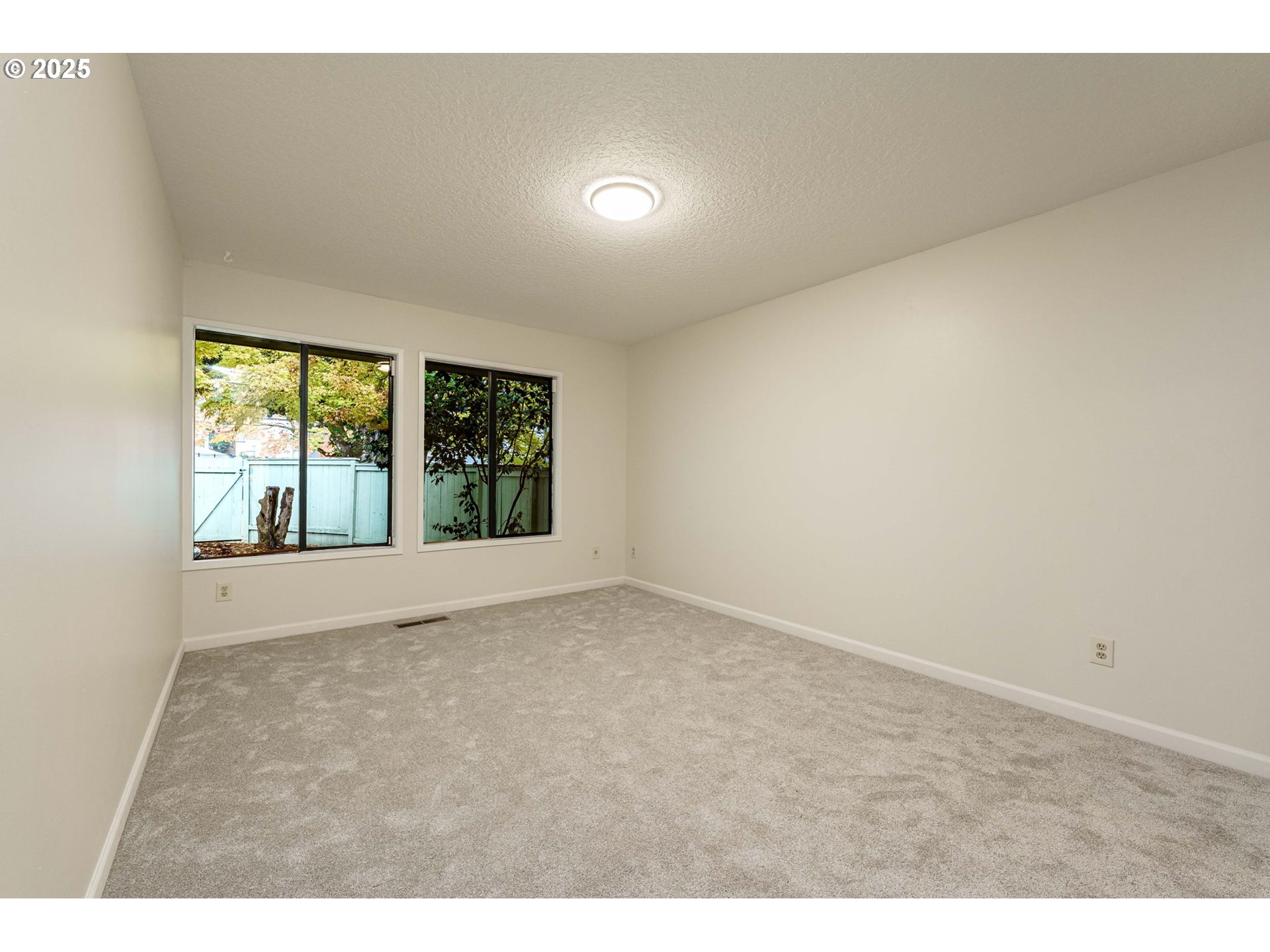 4248 Northeast 125th Place Portland, OR 97230 - Photo 22 of 42 a view of an empty room with a window