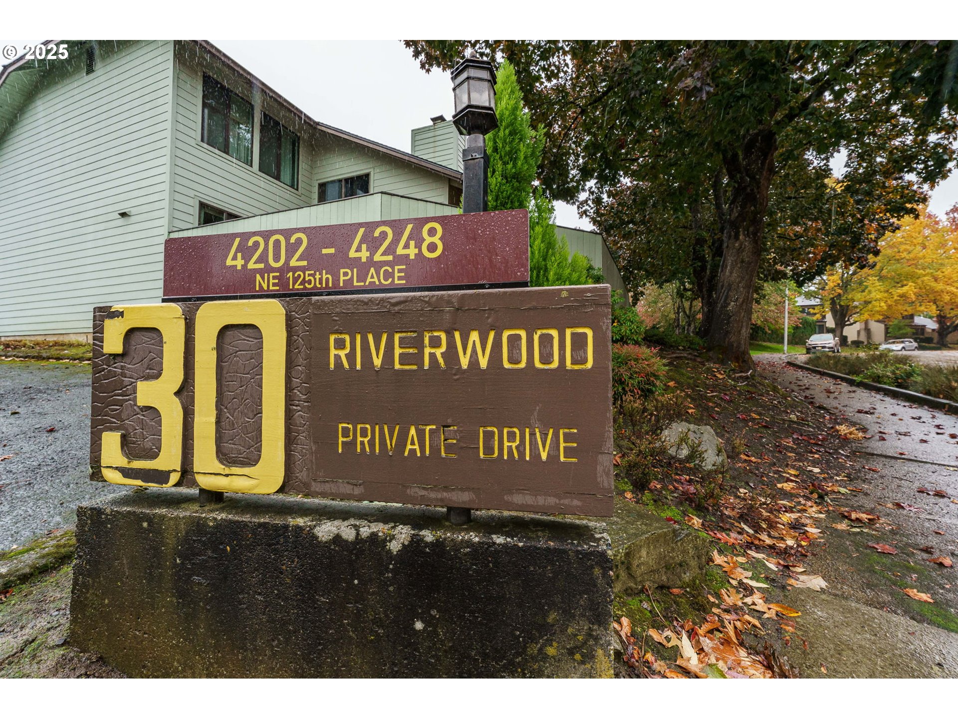 4248 Northeast 125th Place Portland, OR 97230 - Photo 38 of 42 a sign broad in front of the red brick house