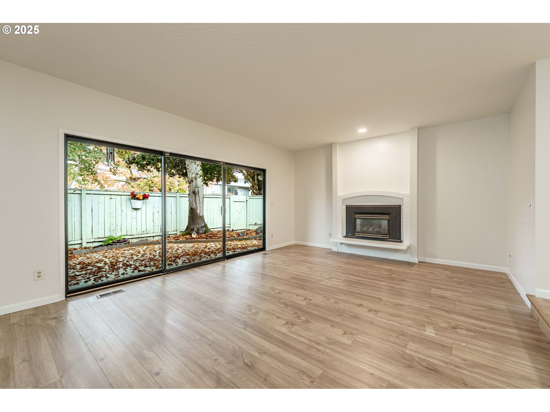 4248 Northeast 125th Place Portland, OR 97230 - Photo 5 of 42 a view of an empty room with wooden floor and a window