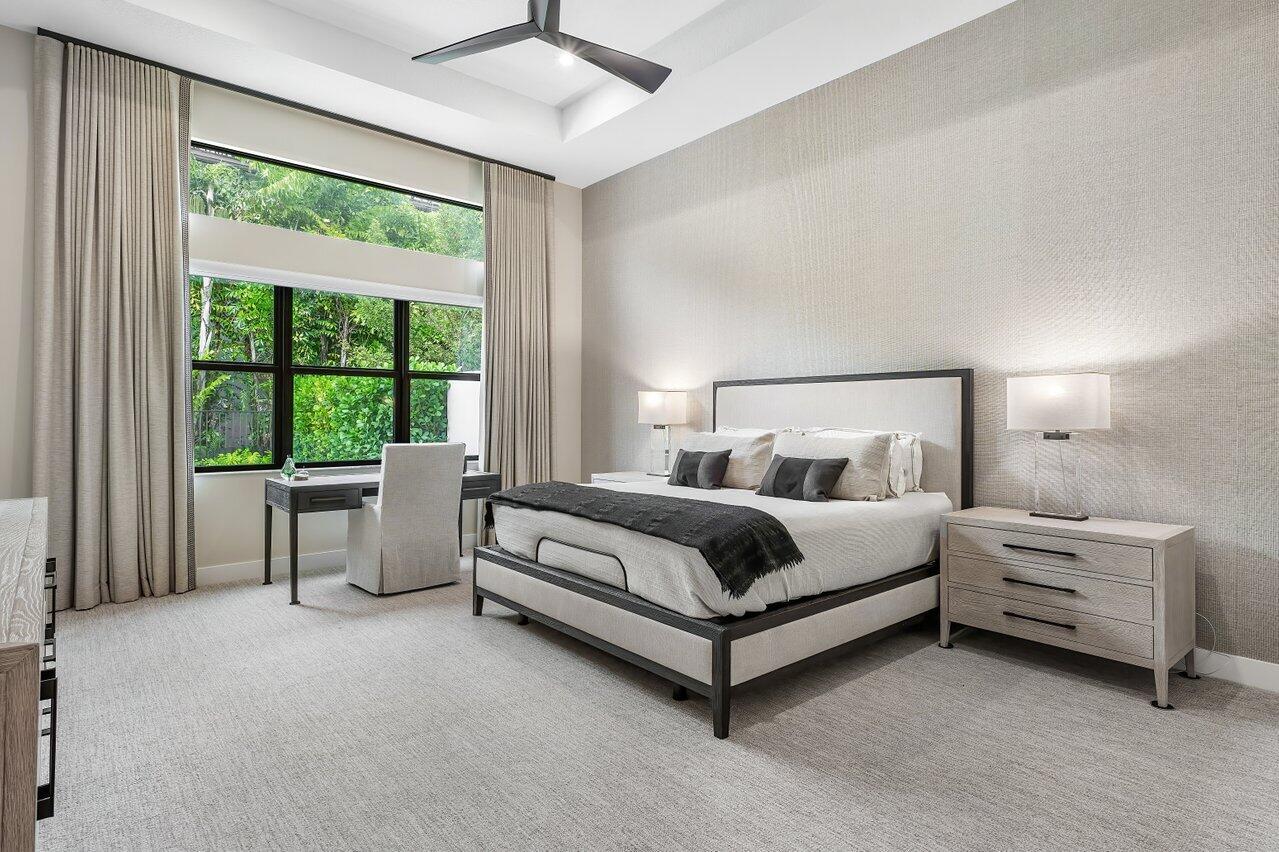 9109 Fiano Place Boca Raton, FL 33496 - Photo 11 of 24 a bed sitting in a bedroom next to a window