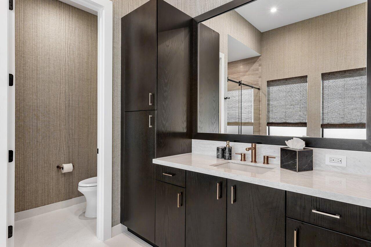 9109 Fiano Place Boca Raton, FL 33496 - Photo 14 of 24 a bathroom with a sink and a mirror