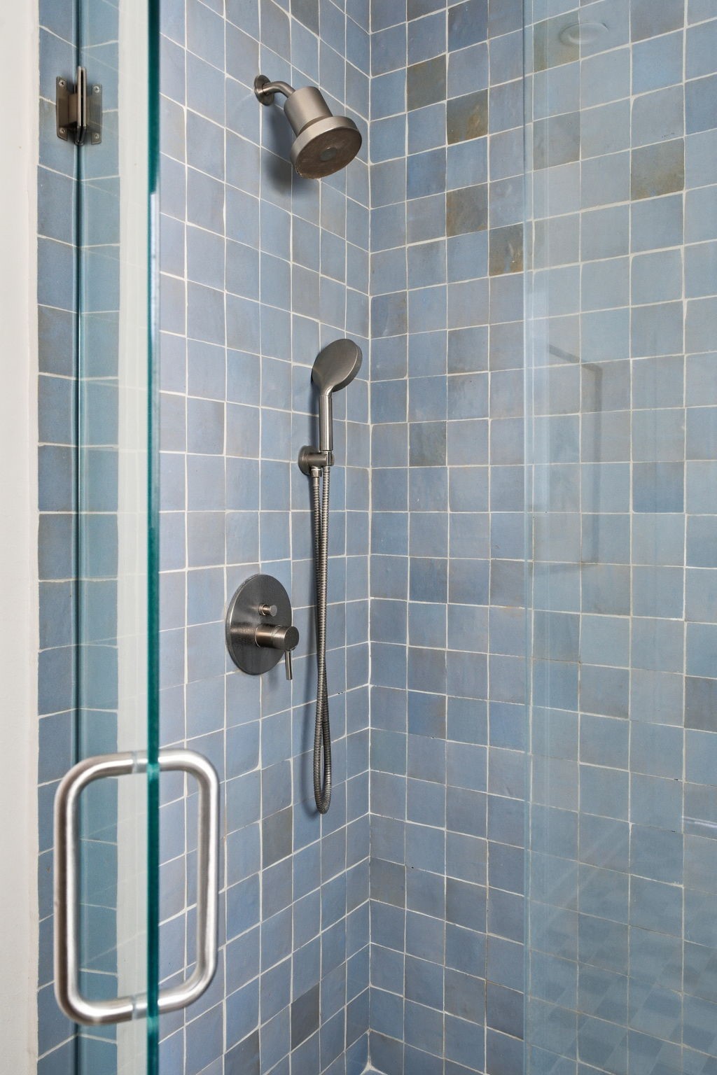 1103 Key Street Houston, TX 77009 - Photo 17 of 35 Sleek fixtures, featuring both an overhead and handheld showerhead.