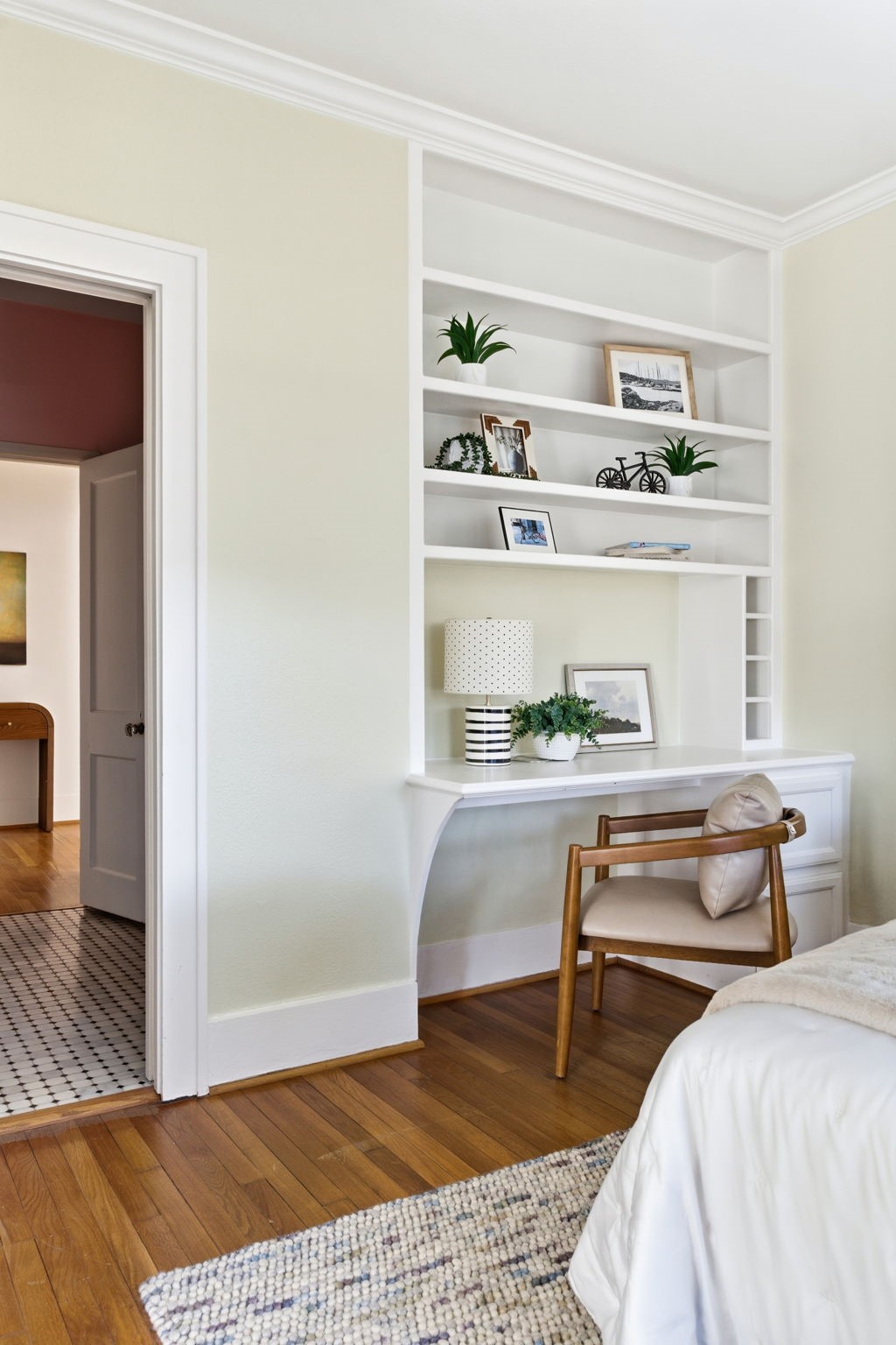 1103 Key Street Houston, TX 77009 - Photo 21 of 35 It includes built-in shelving, and a desk/workspace, creating a welcoming and functional space.