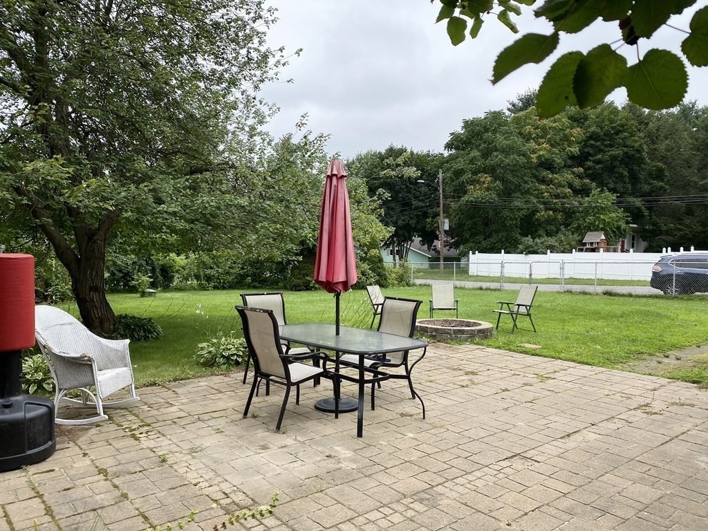 172 Potter Road Framingham, MA 01701 - Photo 16 of 16 a view of a chairs and table in backyard yard