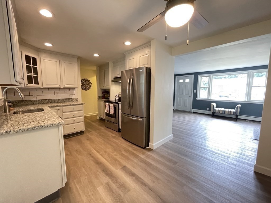 172 Potter Road Framingham, MA 01701 - Photo 2 of 16 a kitchen with stainless steel appliances granite countertop a refrigerator stove and oven