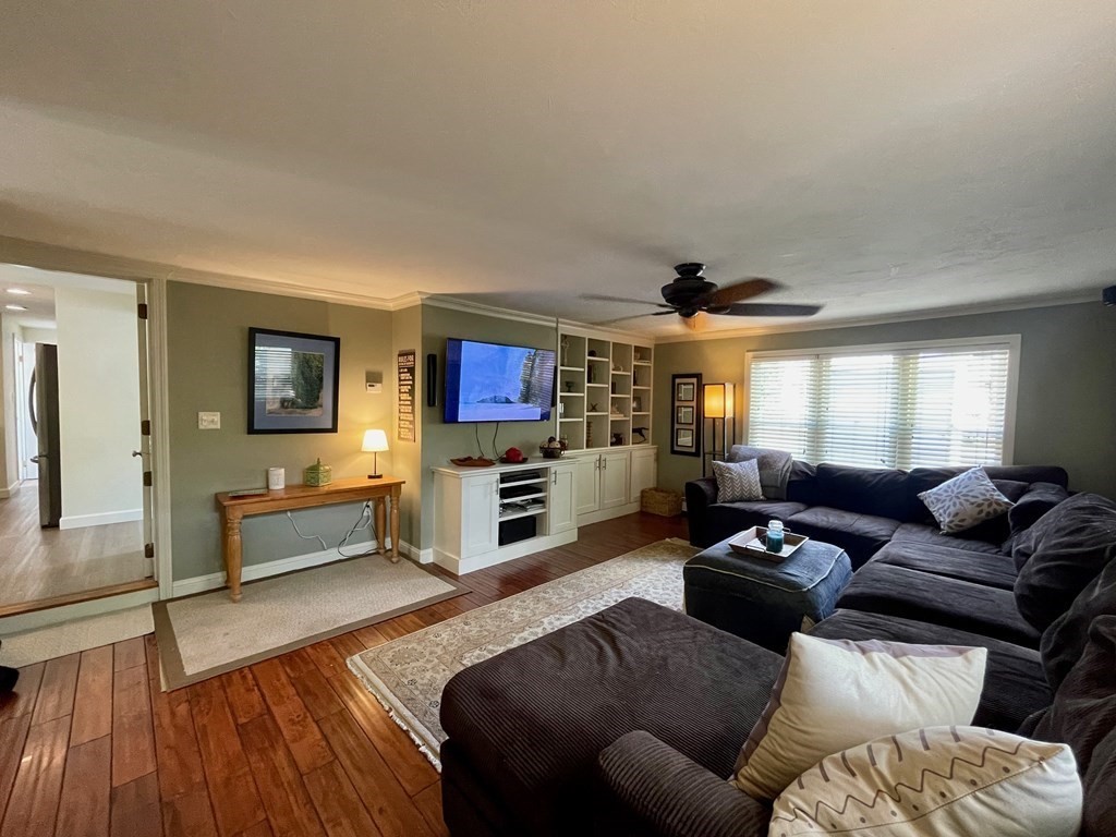 172 Potter Road Framingham, MA 01701 - Photo 5 of 16 a living room with furniture and a wooden floor