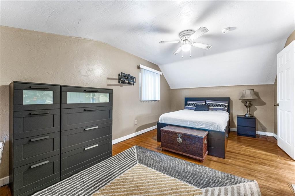 926 Agnew Road Pittsburgh, PA 15227 - Photo 12 of 22 a spacious bedroom with a bed and a dresser