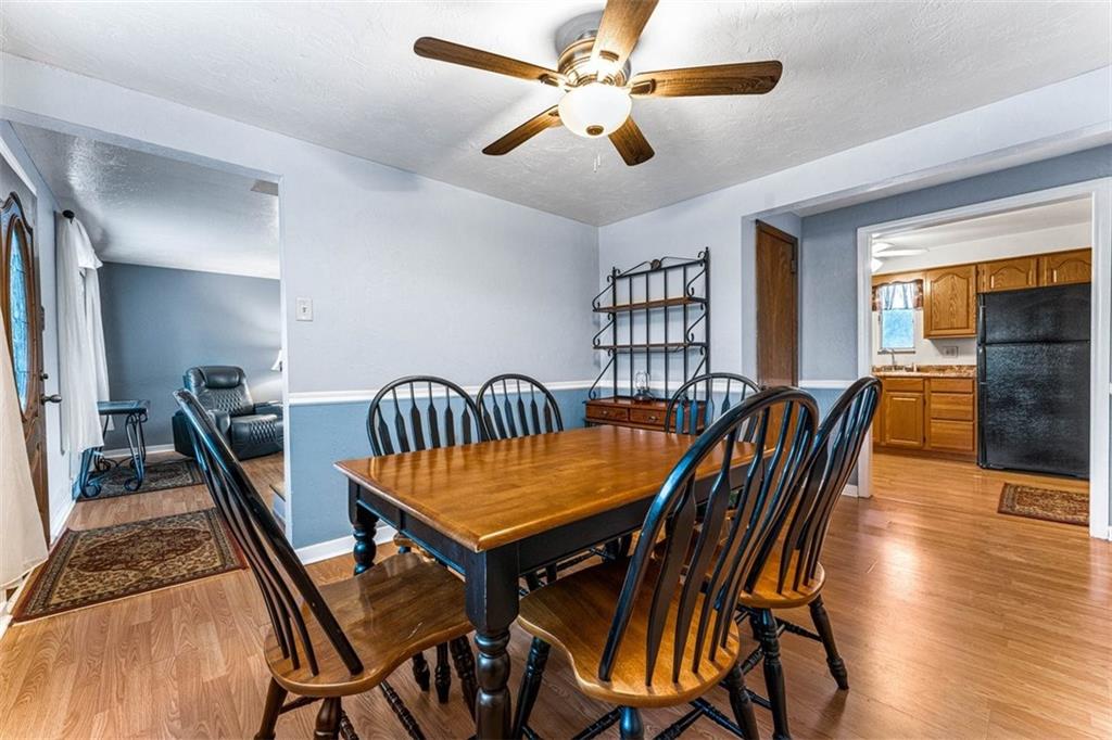926 Agnew Road Pittsburgh, PA 15227 - Photo 10 of 22 a view of a dining room with furniture and wooden floor