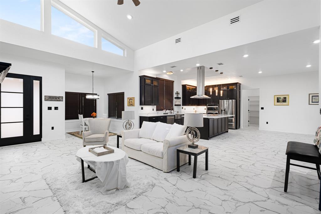 1572 Faulkner Road Sunset, TX 76270 - Photo 13 of 40 a living room with furniture and a flat screen tv