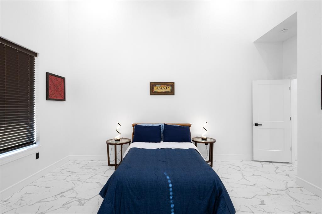 1572 Faulkner Road Sunset, TX 76270 - Photo 19 of 40 a bedroom with a bed and chair