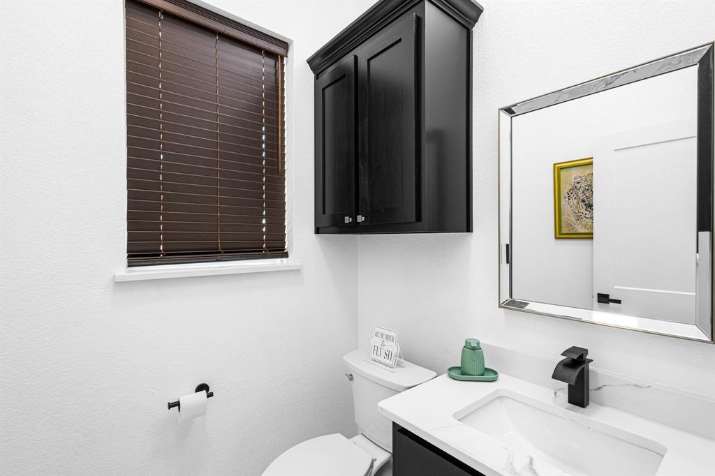 1572 Faulkner Road Sunset, TX 76270 - Photo 28 of 40 a bathroom with a sink and a toilet