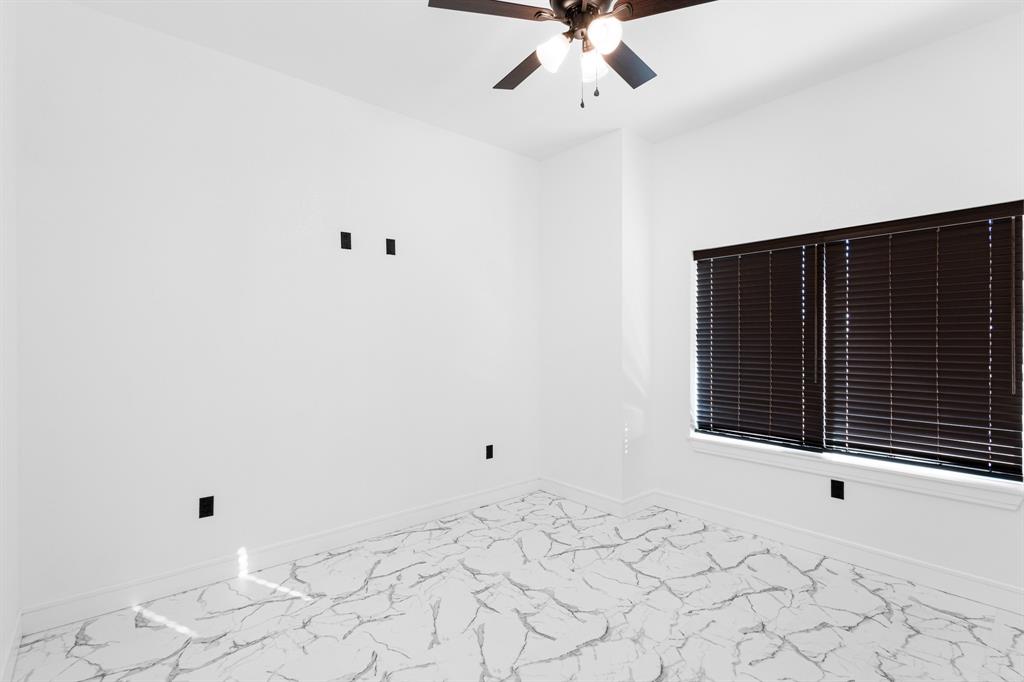 1572 Faulkner Road Sunset, TX 76270 - Photo 29 of 40 a view of a room with a large window and chandelier fan